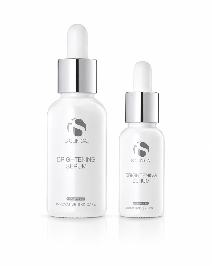 Two white glass serum bottles with droppers, labeled 'Brightening Serum' by iS CLINICAL, on a white background.