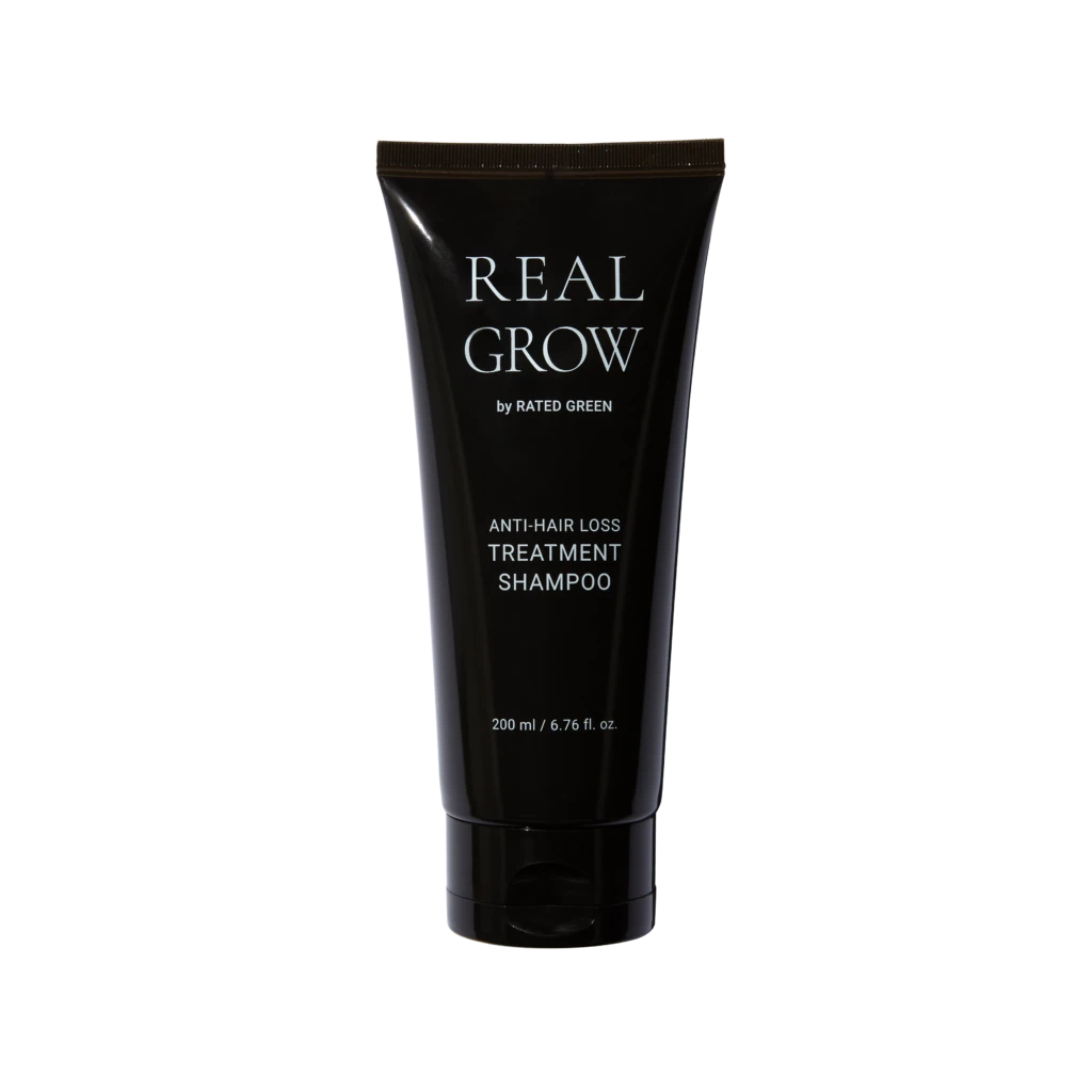 Real Grow anti-hair loss treatment shampoo tube on a black background, 200 ml