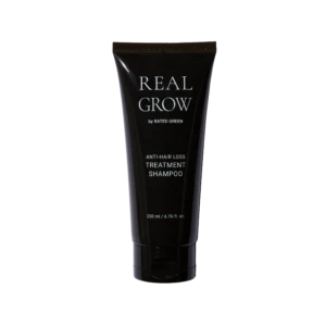 Real Grow anti-hair loss treatment shampoo tube on a black background, 200 ml