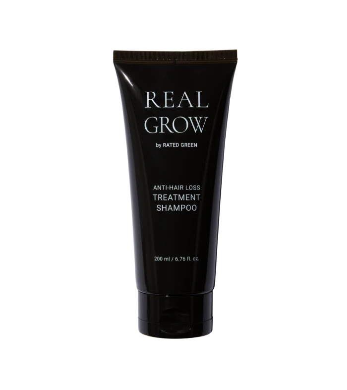 Real Grow anti-hair loss treatment shampoo tube on a black background, 200 ml