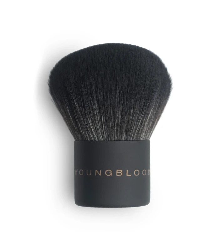 Close-up of a dense black makeup brush head with a dark handle visible at the bottom.