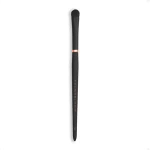 Vertical image of a black makeup brush with dense bristles against a white background; handle shows faint vertical text.