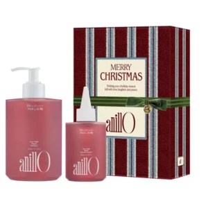 Holiday gift set: two pink AnillO haircare bottles beside a striped red Christmas box labeled Merry Christmas.