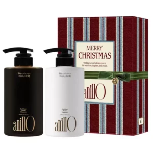 AnillO hair care gift set with two pump bottles beside a striped red Christmas gift box.