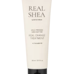 Beige skincare tube labeled Real Shea by Rated Green; cold-pressed shea butter treatment with avocado oil (240 ml).