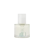 Bottle of Neroli Wood Glow Hair Essence by anillo, clear glass with a white cap on a light background.