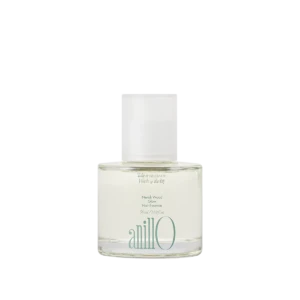 Bottle of Neroli Wood Glow Hair Essence by anillo, clear glass with a white cap on a light background.