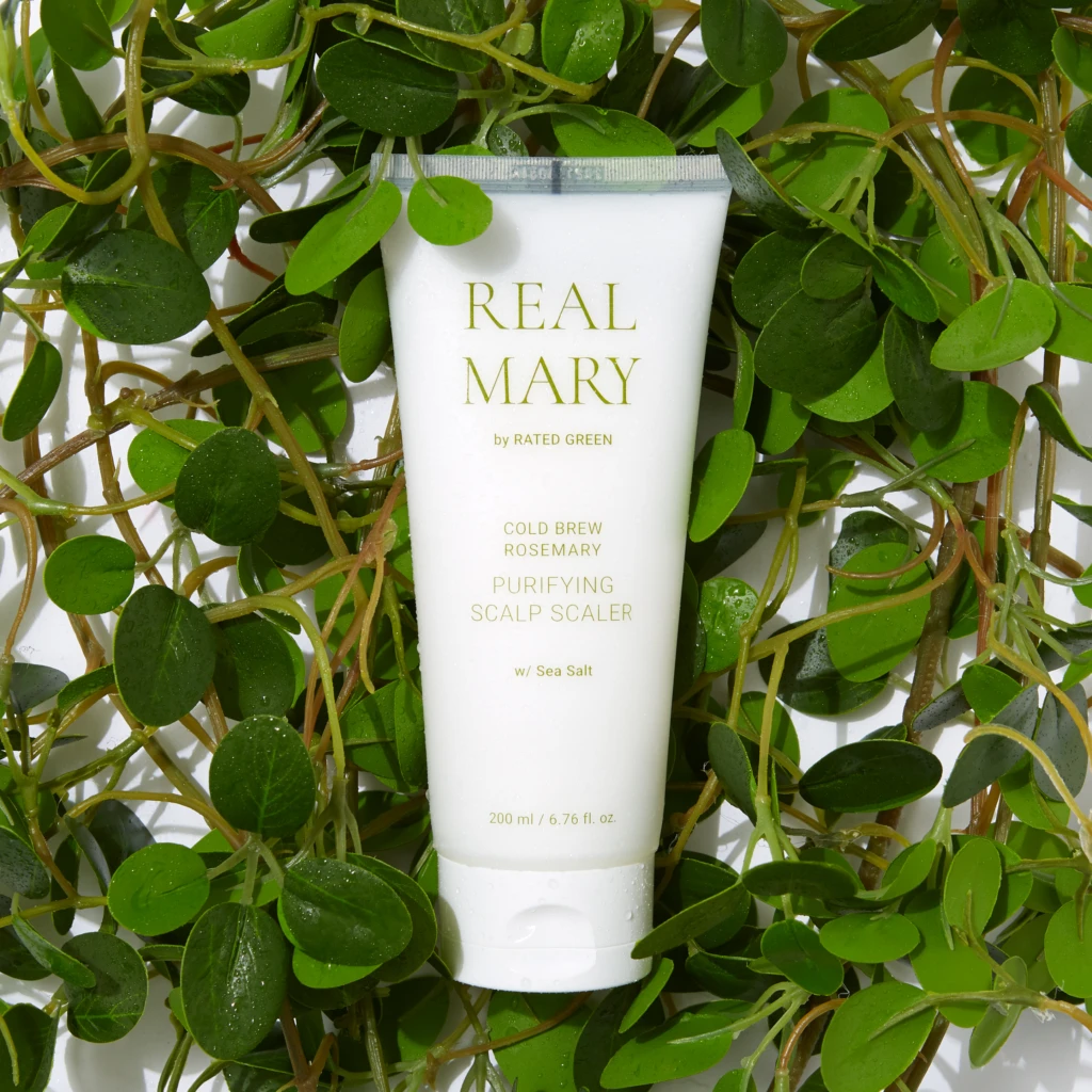 White tube labeled REAL MARY nestled among trailing green leaves and vines