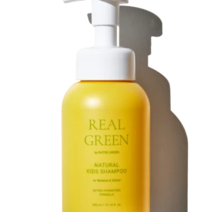 Yellow pump bottle of natural kids shampoo with white pump top against a black background; label reads 'Real Green' and 'Natural Kids Shampoo'.