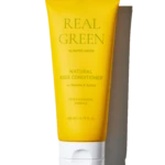 Yellow tube of Real Green Natural Kids Conditioner with Betaine & Xylitol, 200 ml, standing upright against a black background, show product branding clearly.