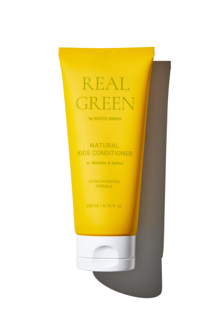 Yellow tube of Real Green Natural Kids Conditioner with Betaine & Xylitol, 200 ml, standing upright against a black background, show product branding clearly.