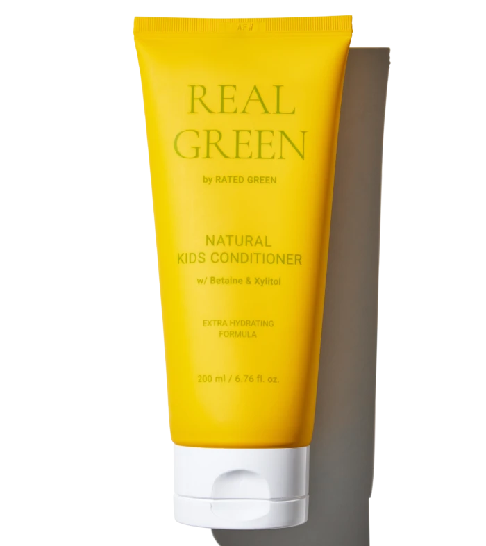 Yellow tube of Real Green Natural Kids Conditioner with Betaine & Xylitol, 200 ml, standing upright against a black background, show product branding clearly.