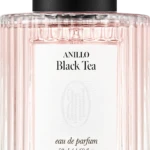 Front view of a pale pink perfume bottle with a black cap, label reads ANILLO Black Tea, eau de parfum 50 ml.