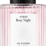 Close-up of a pink ribbed perfume bottle with a black cap; label reads ANILLO Rosy Night, eau de parfum, 50 ml.