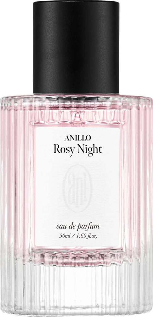Close-up of a pink ribbed perfume bottle with a black cap; label reads ANILLO Rosy Night, eau de parfum, 50 ml.