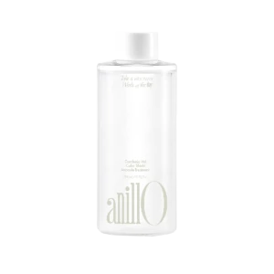 Bottle of Anillo Gardenia Veil Ampoule Treatment cosmetic product, white cylindrical container with soft gold text and cap.
