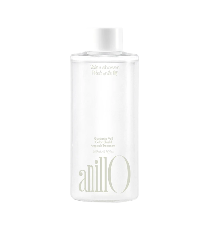 Bottle of Anillo Gardenia Veil Ampoule Treatment cosmetic product, white cylindrical container with soft gold text and cap.