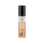 Bottle of AnillO Black Tea Nourishing Cream Hair Mist with a black cap and beige-tinted liquid at the base