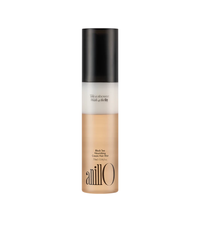 Bottle of AnillO Black Tea Nourishing Cream Hair Mist with a black cap and beige-tinted liquid at the base