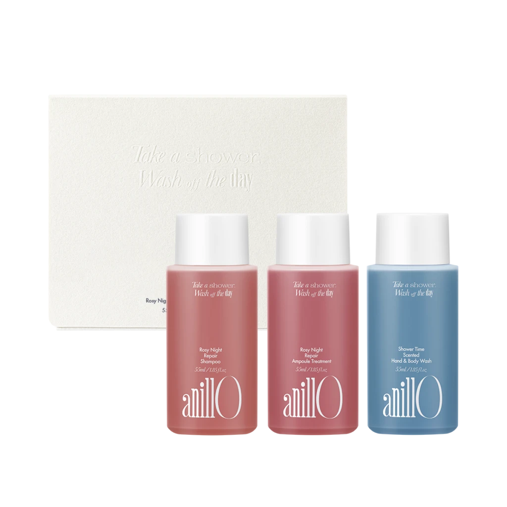 Set of three AnillO bath products in pink and blue bottles in front of a white textured box with embossed text 'Take a shower, Wash off the day'.