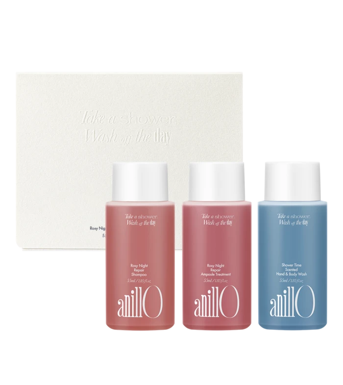 Set of three AnillO bath products in pink and blue bottles in front of a white textured box with embossed text 'Take a shower, Wash off the day'.