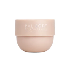 Peach-colored cosmetic jar with white lettering reading 'BALIBODY ESSENTIALS' and 'Body Scrub' text visible on the label.