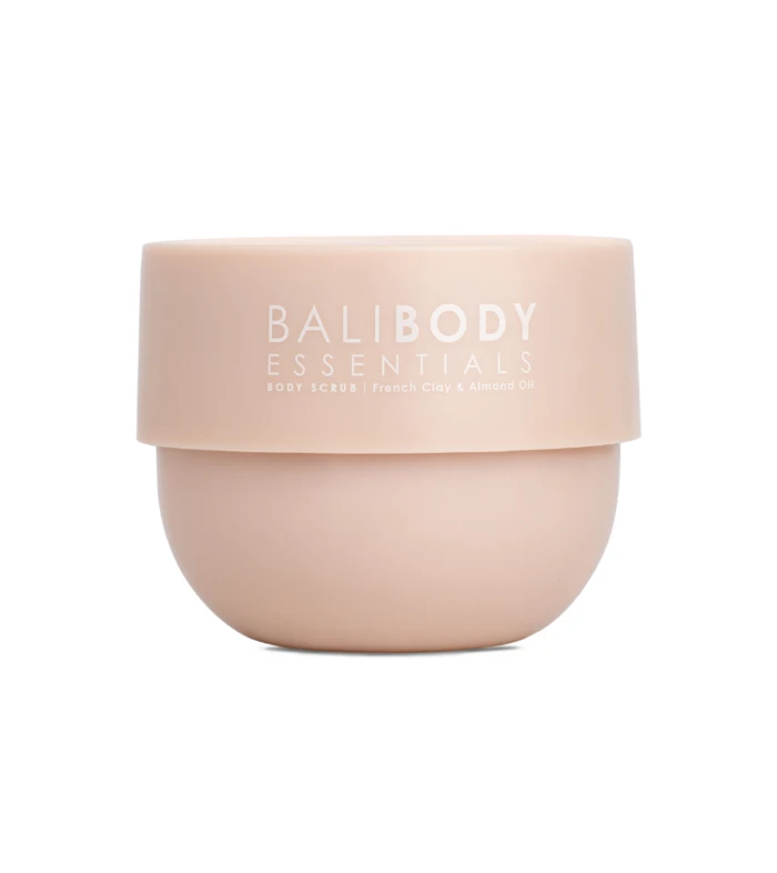 Peach-colored cosmetic jar with white lettering reading 'BALIBODY ESSENTIALS' and 'Body Scrub' text visible on the label.