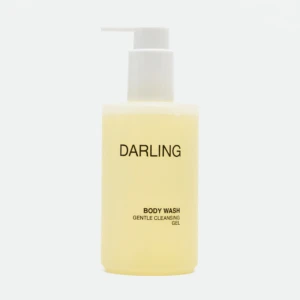 Pale yellow pump bottle labeled DARLING with a white pump, indicating body wash.