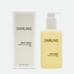 Boxed Darling body wash and a yellow bottle with pump labeled 'Body Wash' and 'Gentle Cleansing Gel' visible