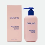 Pink Darling body wash bottle with a blue pump next to its matching pink box, showing the brand name and 'Multi-Biotics' label.