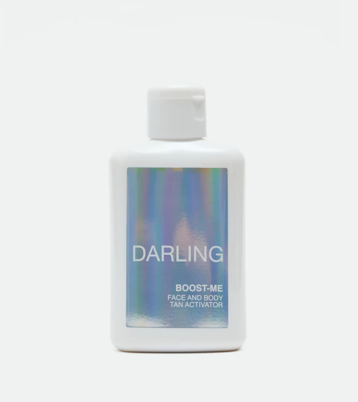 White pump bottle with a holographic label reading DARLING.