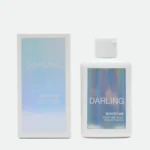 Box and bottle of Darling Boost-Me Face and Body Tan Activator on a white background; blue gradient packaging on the box and a white bottle with a blue label.