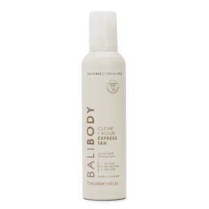 White lotion bottle with a tall, slim shape and a rounded cap; label reads 'Invisible Streak Free' and 'Clinically Tested' with cosmetic branding.