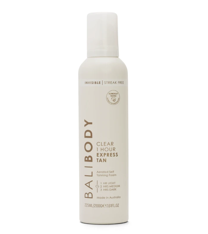 White lotion bottle with a tall, slim shape and a rounded cap; label reads 'Invisible Streak Free' and 'Clinically Tested' with cosmetic branding.