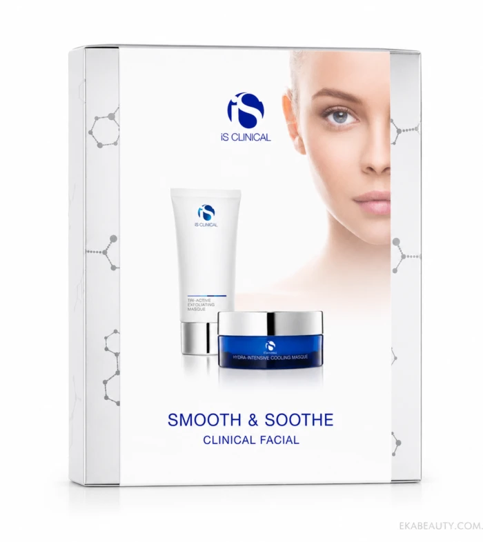 Boxed iS Clinical skincare set (Smooth & Soothe Clinical Facial) with a white tube and blue jar in front of a partial model's face on a white background.