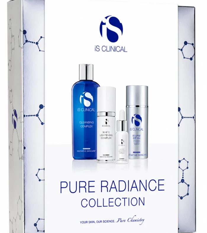 Boxed iS Clinical Pure Radiance Collection skincare set with blue cleansing bottle and white/silver bottles shown against white backdrop.