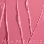 Close-up pink abstract background with glossy ribbon-like lines and the text 'PINK PROSECCO' at the bottom.