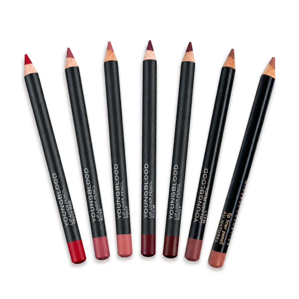 Seven black lip liner pencils with pink-nude to burgundy shades arranged diagonally on a white background.