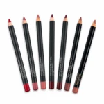 Seven black lip liner pencils with pink-nude to burgundy shades arranged diagonally on a white background.