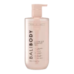 Bottle of self-tanning gel with a pump dispenser, pale pink container labeled 'Self Tan' and 'Dark'.