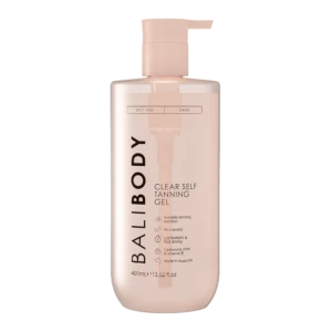 Bottle of self-tanning gel with a pump dispenser, pale pink container labeled 'Self Tan' and 'Dark'.