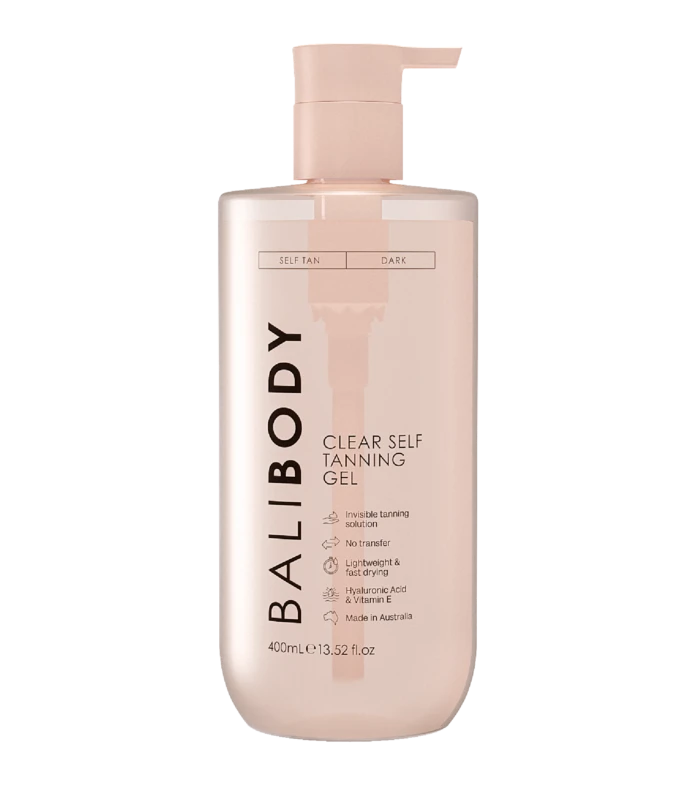 Bottle of self-tanning gel with a pump dispenser, pale pink container labeled 'Self Tan' and 'Dark'.