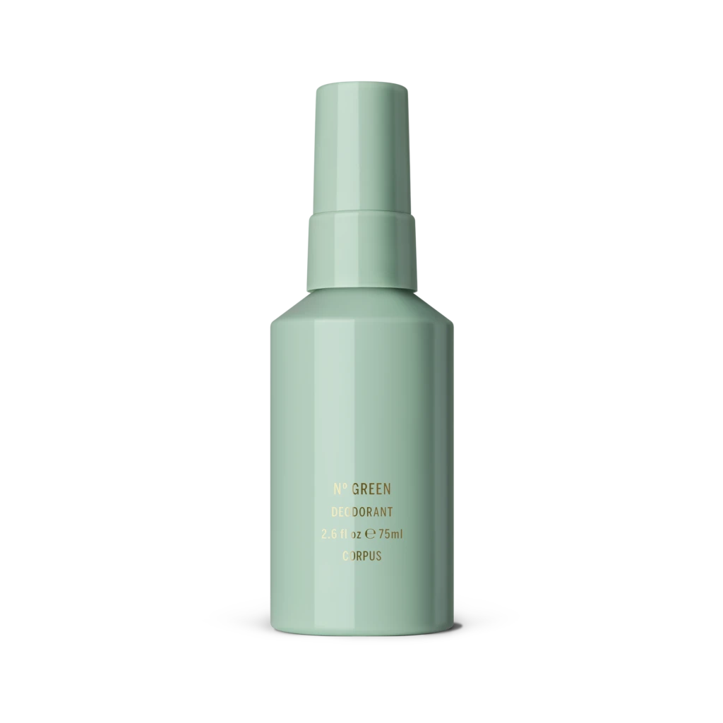 Mint-green deodorant bottle standing on a white surface, label with gold text visible (No Green Deodorant).
