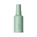Mint green deodorant bottle with gold text reading POMELO on a gray surface.