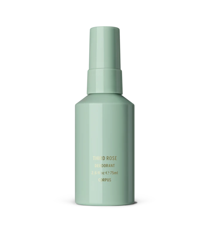 Mint green cylindrical deodorant bottle with cap, label reads 'Third Rose Deodorant' on a neutral gray backdrop.