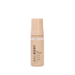 Peach-colored self-tanning mousse bottle with pump top, showing the label 'Dark Streak Free' and 'Self Tanning Mousse' on a white background