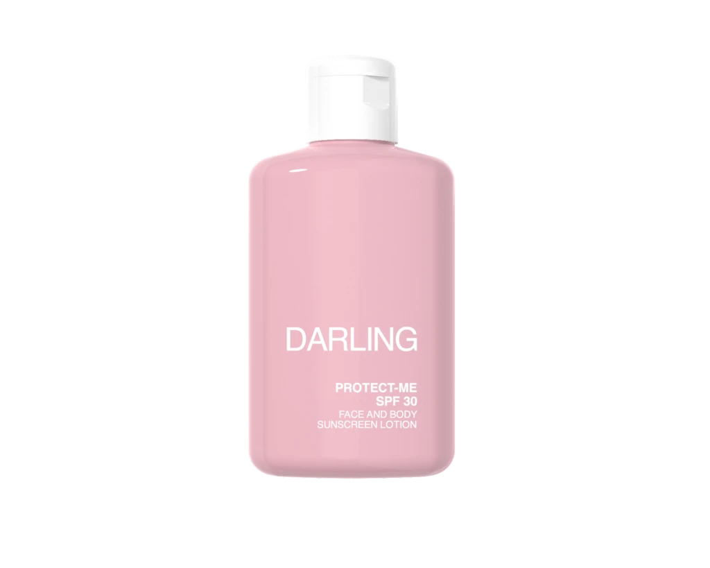Pink bottle of Darling Protect-Me SPF 30 sunscreen lotion with a white cap, shown from the front.