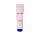 Pink cylindrical tube labeled DARLING with a blue cap at the bottom, advertising Multi-Biotics Renewing and Smoothing Body Scrub against a black background.