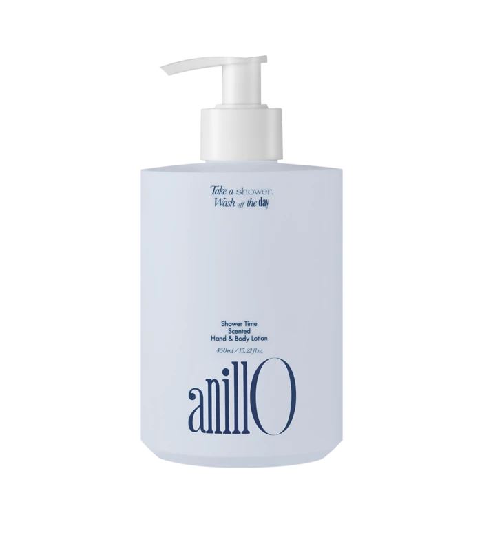 White lotion pump bottle with light blue label; reads 'Take a shower. Wash off the day' and 'Shower Time Scented Hand & Body Lotion' with the brand 'anillo' at the bottom.