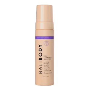 Peach-colored self-tanning mousse bottle with a purple label reading 'DEEP VIOLET | STREAK FREE' and upright orientation.